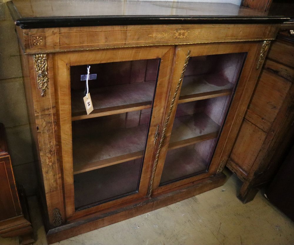 A late Victorian figured walnut gilt metal mounted pier cabinet, width 96cm, depth 32cm, height 99cm